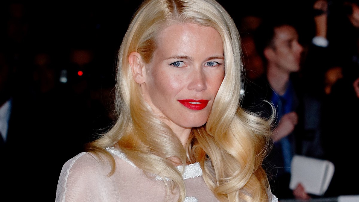 Claudia Schiffer is every inch the model bride in hourglass gown in candid wedding photo